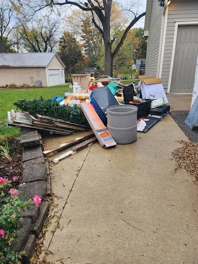 Dumpster being loaded with debris for 3 Yard Dumpster Rental in Floresville